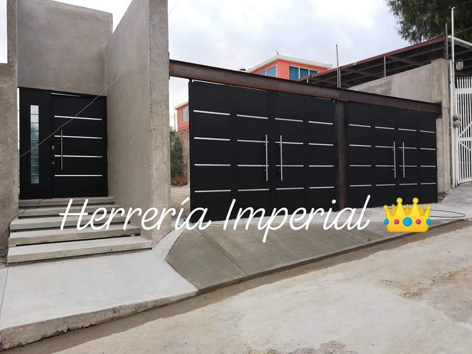 Portones estilo minimalistas., Herreria y Aluminio Imperial Herreria y Aluminio Imperial Porte da garage Ferro / Acciaio