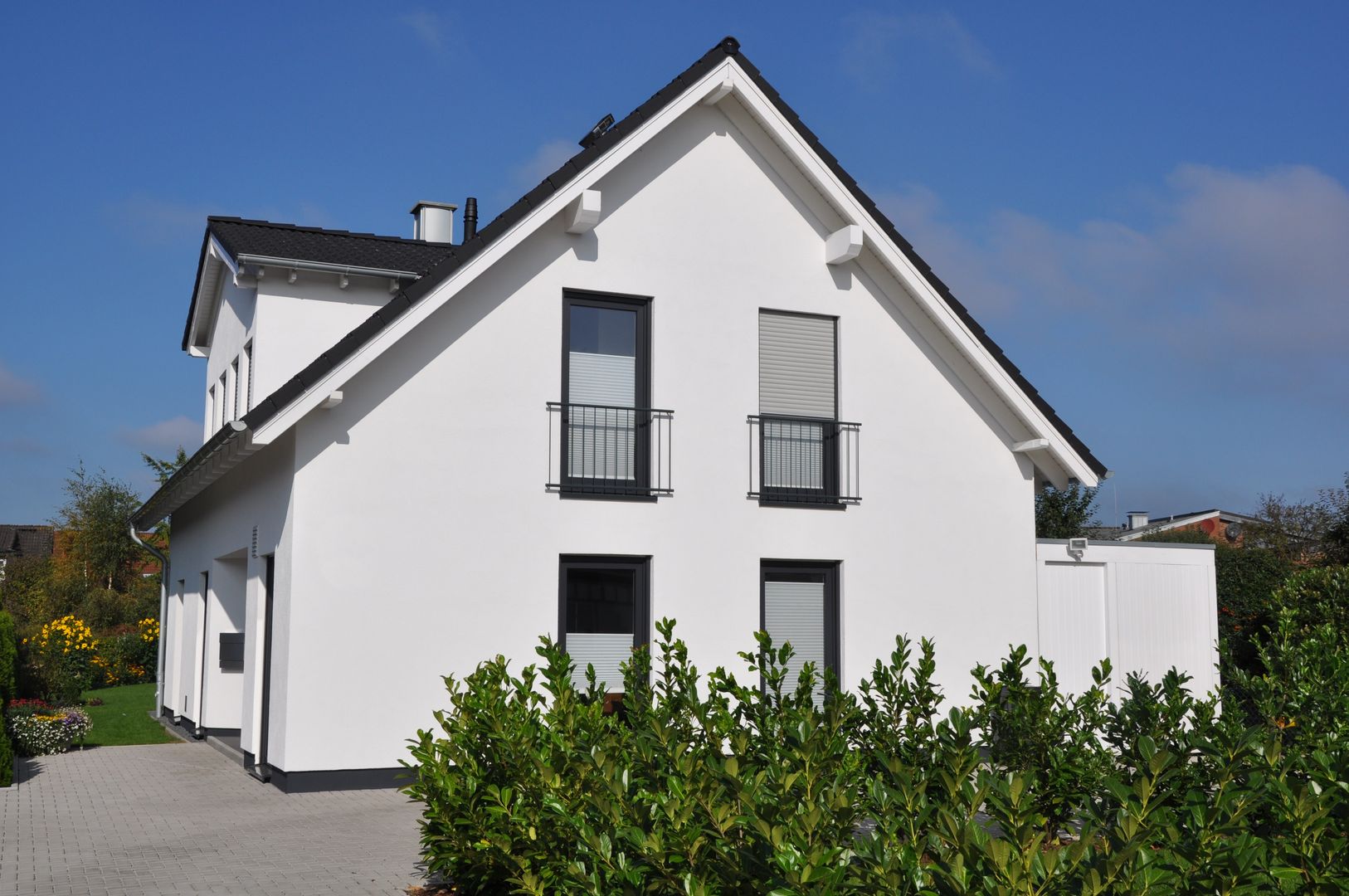 Einfamilienhaus mit Putzfassade, Menschen und Räume GmbH Menschen und Räume GmbH Single family home