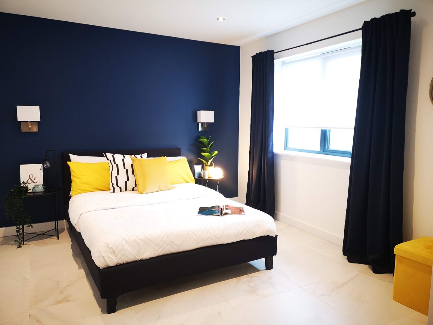 Contrasting navy bedroom THE FRESH INTERIOR COMPANY Małe sypialnie Marmur Dulux sapphire salute mustard accessories Ikea curtains marble tiled floor