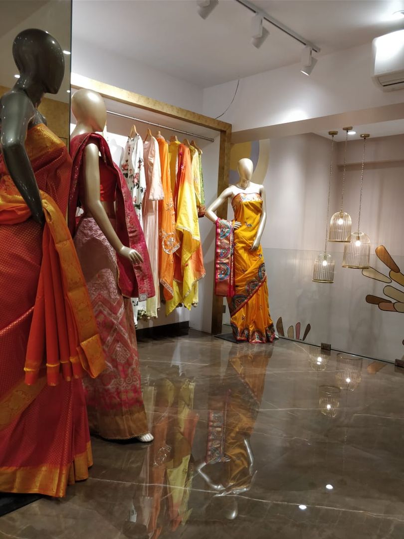 Premium Photo | Front view of a showroom of a ladies saree fashion Boutique  Generative Ai