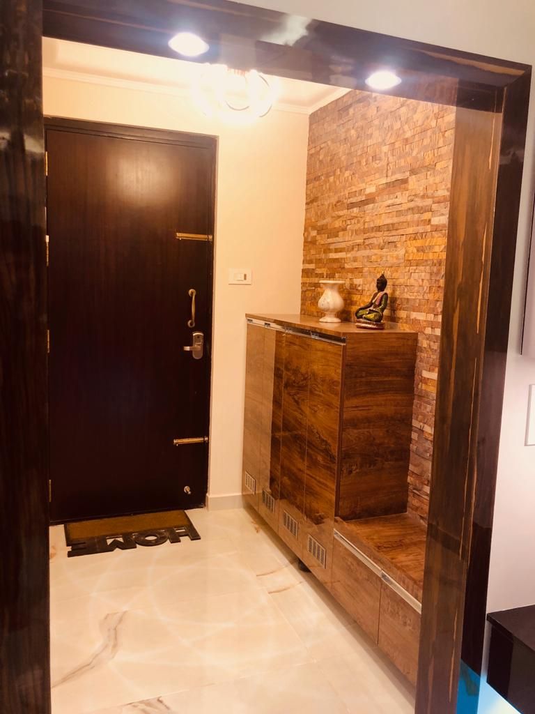 3 bhk at Shriram Chirping Woods, Bangalore, 12 Square Interiors 12 Square Interiors Corredores, halls e escadas modernos Contraplacado