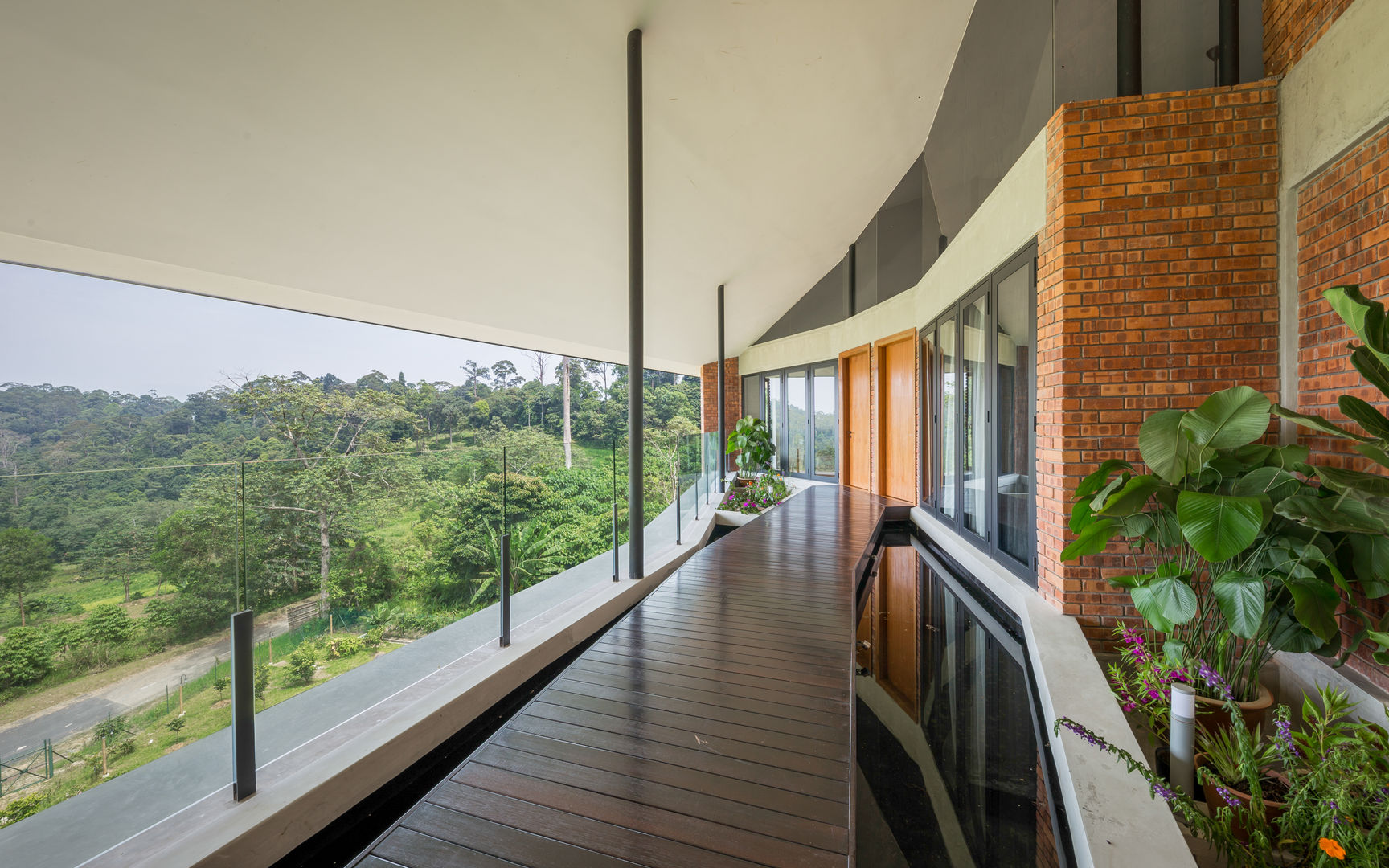 Outdoor water feature MJ Kanny Architect Tropical style corridor, hallway & stairs