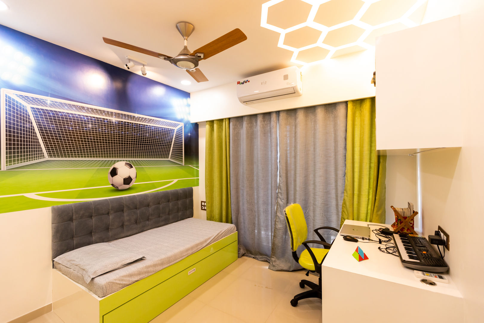 The Golden Touch The 7th Corner Interior Pokój dla chłopca interior design, interior, interior designer in mumbai, luxury interior, interior designer, home interior, residential interior, ac pelmet, bed, Bedroom, ceiling, colour, curtain, design, door, fan, football, football theme, green, hexagon, indirect light, kid, kid bedroom, Kid room, ledge lights, Paint & Wall Coverings, planning, room, space, storage, strip light, wall, wardrobe