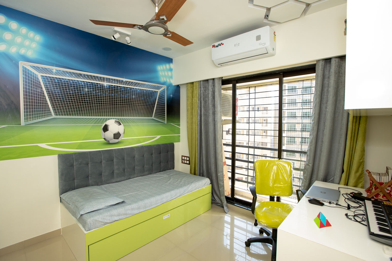 The Golden Touch The 7th Corner Interior غرفة نوم أولاد interior design, interior, interior designer in mumbai, luxury interior, interior designer, home interior, residential interior, ac pelmet, bed, Bedroom, ceiling, colour, curtain, design, door, fan, football, football theme, green, hexagon, indirect light, kid, kid bedroom, Kid room, ledge lights, Paint & Wall Coverings, planning, room, space, storage, strip light, wall, wardrobe