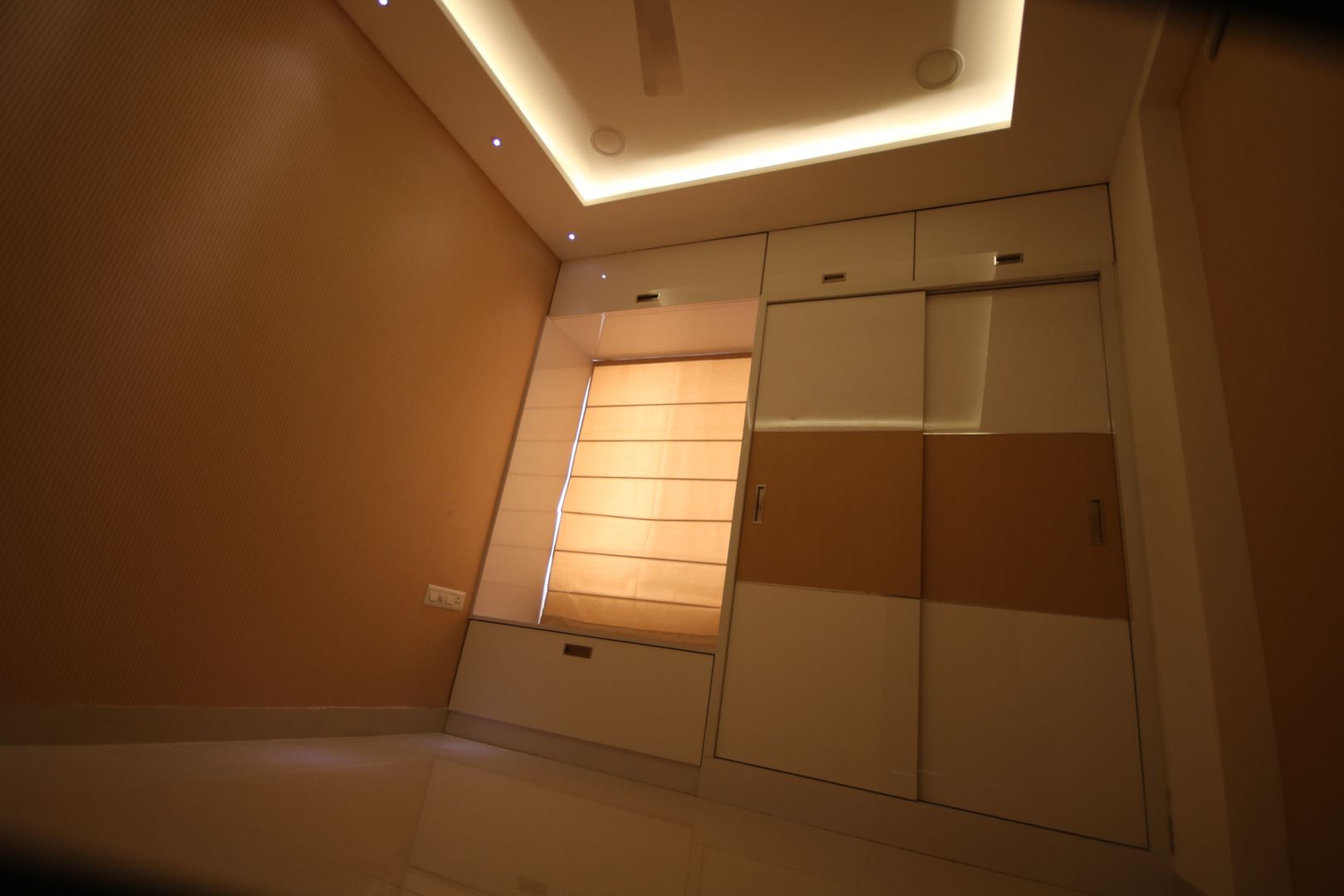 Wardrobe - highlighter on shutters with warm white lighting. Enrich Interiors & Decors Small bedroom Wardrobe, Parents bedroom, beige theme