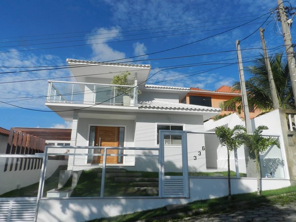 projeto casa terreno aclive em cabo Frio, Estelita Arquiteta Estelita Arquiteta Rumah teras Beton