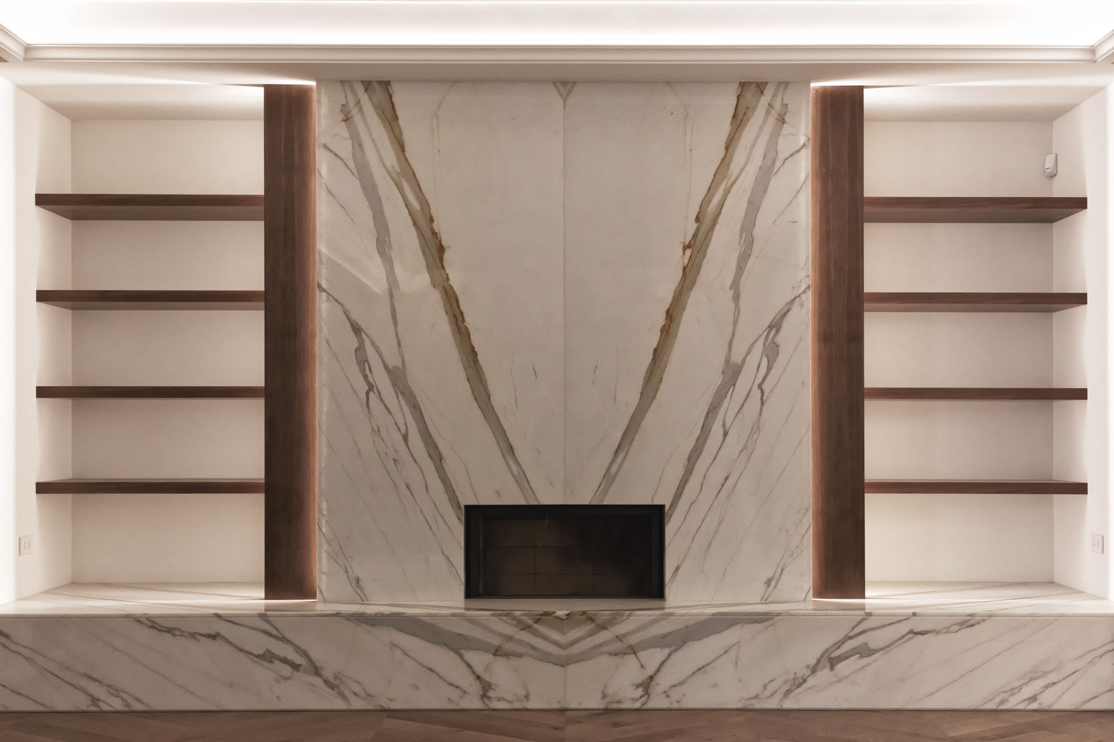 The fireplace finished in Calacatta marble & mahogany shelving Tognini Bespoke Furniture Living room Marble TV stands & cabinets